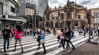 People walking across the street in Sao Paulo, Brazil.