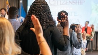 New naturalized US citizen take oath of allegiance at a special naturalization ceremony at New York Public Library on June 30, 2023.