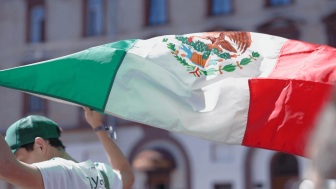 Mexican football fan with flag