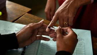 Finger being inked before voting in Indian elections