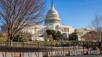 Capitol building behind barricades