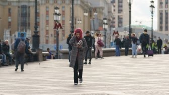 A young woman reads a book in Moscow
