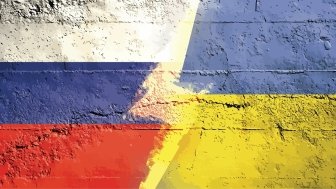 Digital image showing Russian and Ukrainian Flags with bolt going down the middle