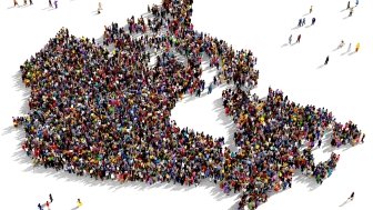 Outline of Canada composed of diverse crowd.