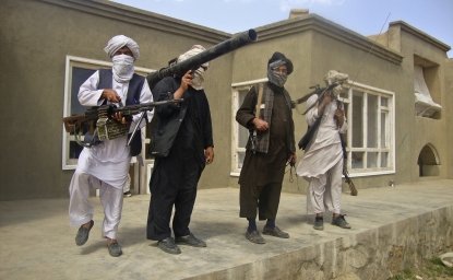 Taliban fighters pose with weapons at an undisclosed location in southern Afghanistan in this May 5, 2011 picture. REUTERS/Stringer