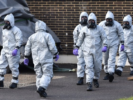 People in hazmat suits clean up the site of the poisoning of Sergei Skripal in Salisbury