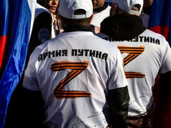 Russian nationalists wearing pro-war "Z" shirts at a rally