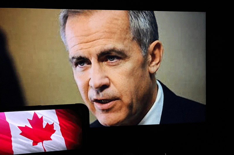 Mark Carney on video screen