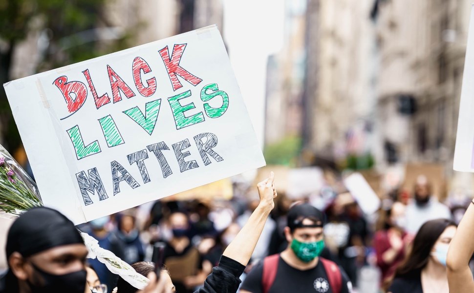 Protests in New York. People with protesting posters marching protest over George Floyd death. Black lives matter movement in New York.
