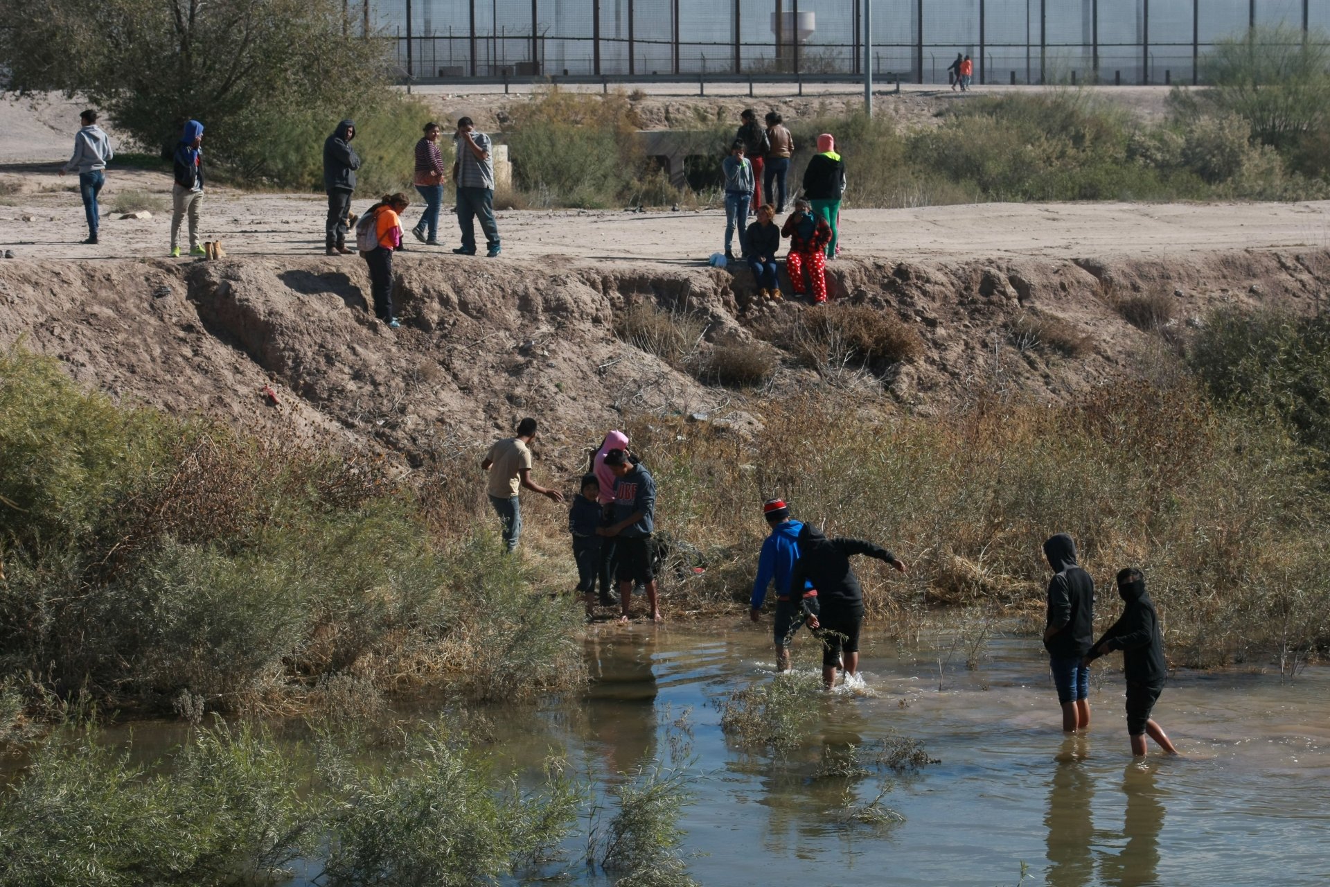 Guatemalan migrants crossing a river