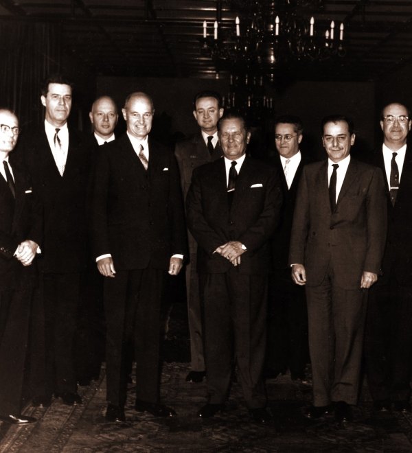 George F. Kennan, American diplomat and historian, posing with others.