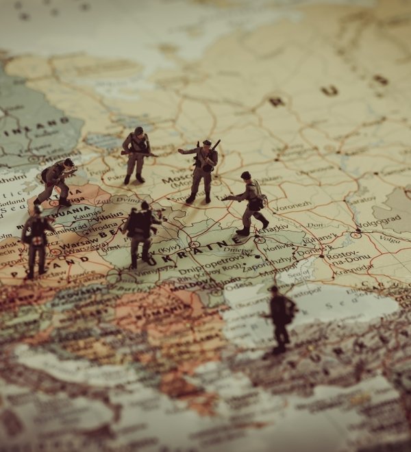 Toy soldiers stand on a map of Europe