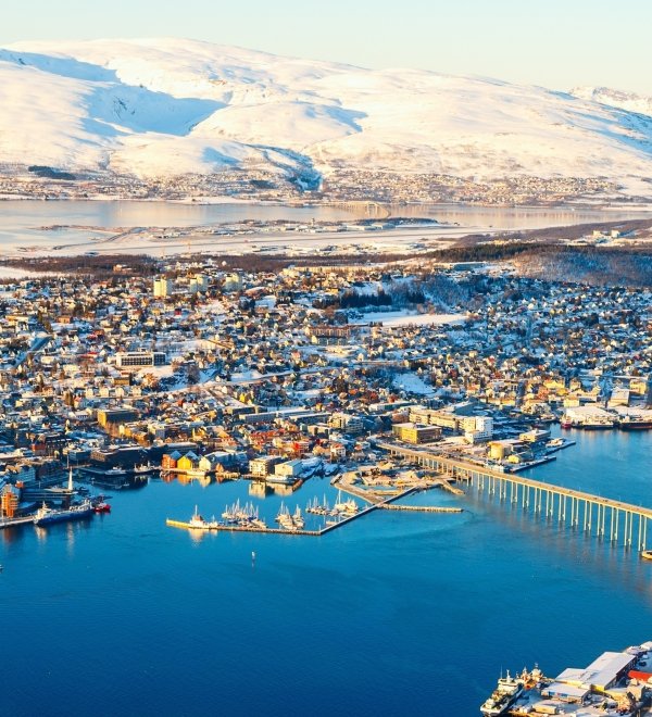 Above view of beautiful winter landscape of snow covered town Tromsoe in Northern Norway