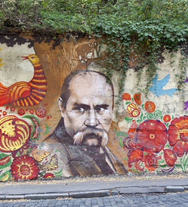 KHARKIV, UKRAINE - OCTOBER 4: City street Belgorod descent and wall graffiti with portrait of famous Ukrainian artist, writer and poet Taras Shevchenko (Kobzar) on October 4, 2012 in Kharkiv, Ukraine.