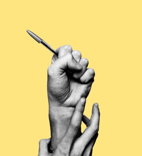 Concept of freedom of speech and information, stop censorship. Hand holding an open pen. It is dragged down by another hand. Black and white subject with a yellow background