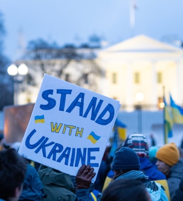 Washington DC, USA- February 24th, 2022: Anti-war Protesters holding pro-Ukraine signs outside the White House after Russia invaded Ukraine.