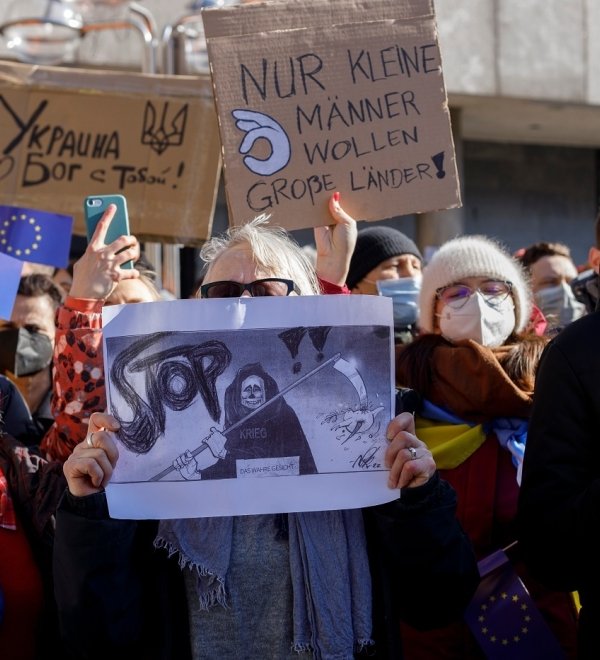 Group of protesters holding sign