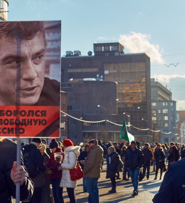 Moscow - February 27, 2016. Memory march of slain politician Boris Nemtsov. Demonstrator with a banner "He fought for free Russia" and portrait of Boris Nemtsov