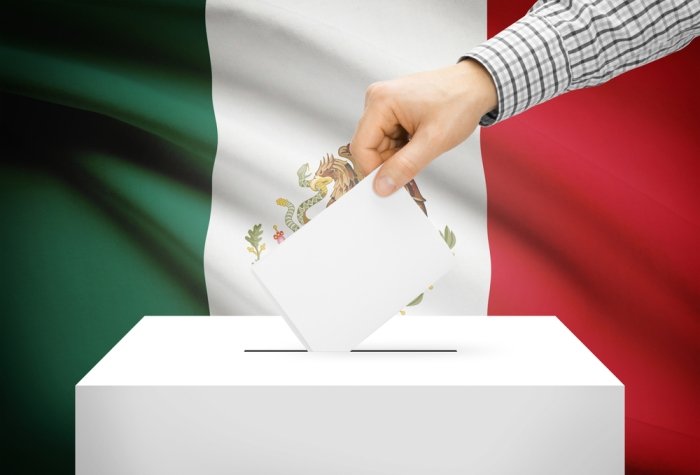 Voting concept - Ballot box with national flag on background - Mexico
