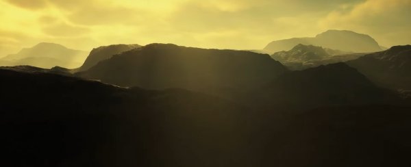 An image of mountains with a yellow sky