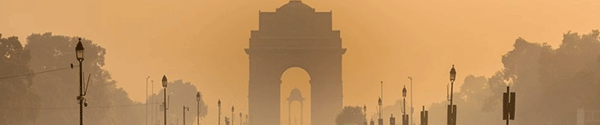 Silhouette of triumphal arch style war memorial during smoggy winter morning