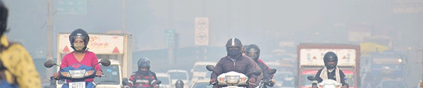 People on mopeds in heavy air pollution