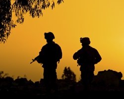 Soldiers in front of a sunset