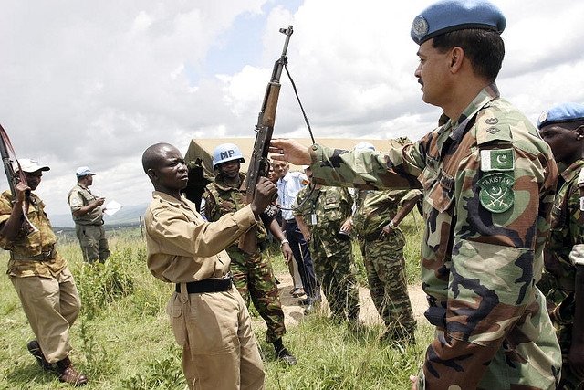 CNDD-FDD forces voluntarily disarm to UN peacekeepers at the end of the Burundian civil war in 2005. President Nkurunziza rose to power as chairman of the CNDD-FDD. Photo by United Nations Photo, Creative Commons