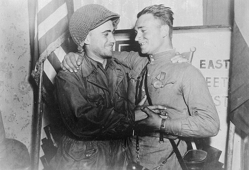 Happy 2nd Lt. William Robertson and Lt. Alexander Sylvashko, Red Army, near Torgau, Germany in April 1945. Source: US National Archives and Records Administration, #531276.