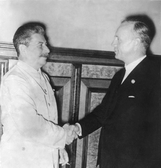 Joachim von Ribbentrop and Joseph Stalin at the signing of the Molotov–Ribbentrop Pact. Source: Wikimedia Commons.