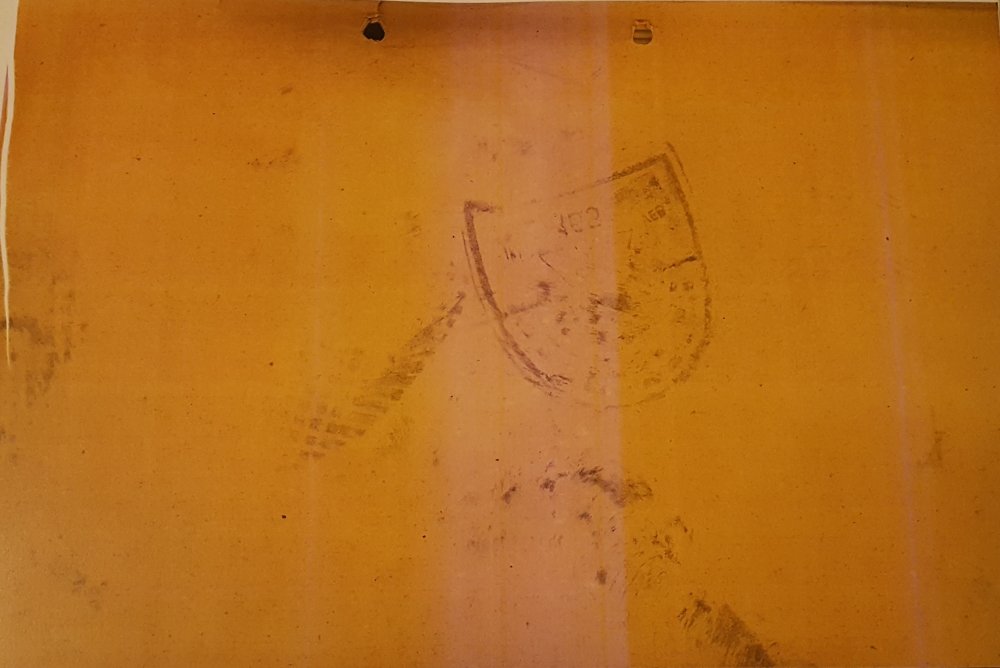 A footprint is visible on the back of one of the documents taken during the 1953 uprising.