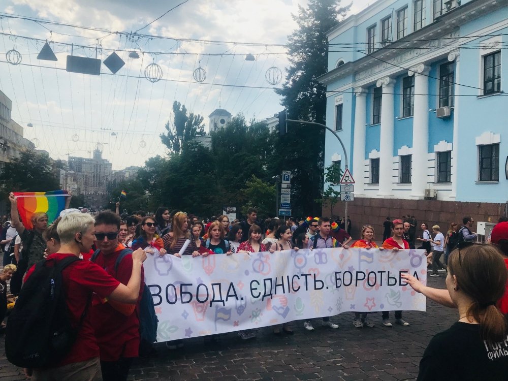 Photo: Ukrainians attending the June 23 Pride march in Kyiv holding a sign saying, "Freedom. Unity. Fight." Source: Jessica Zychowicz.