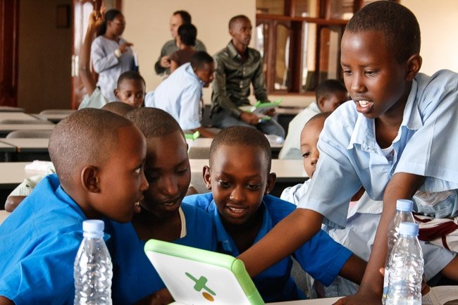 Schoolkids in Rwanda use computers distributed by American NGO One Laptop per Child. The initiative has come in for criticism over price, usefulness, and priorities. Photo by One Laptop per Child, via Flickr. Creative Commons.