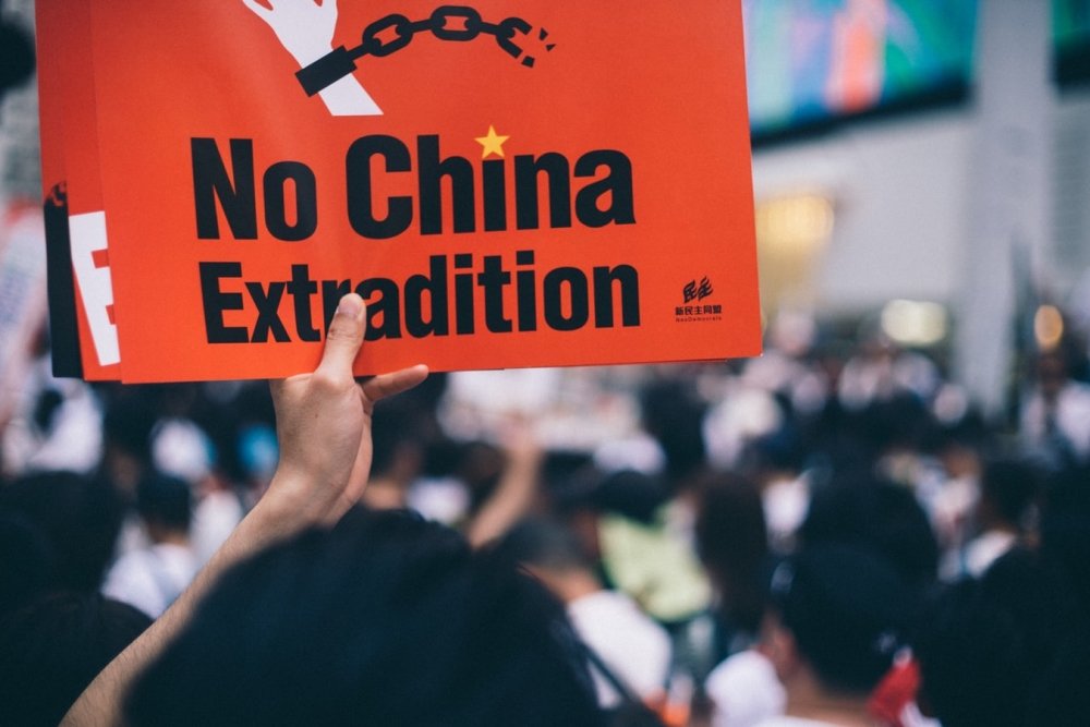 Protester holds sign in Hong Kong extradition protests. Source: Unsplash.com