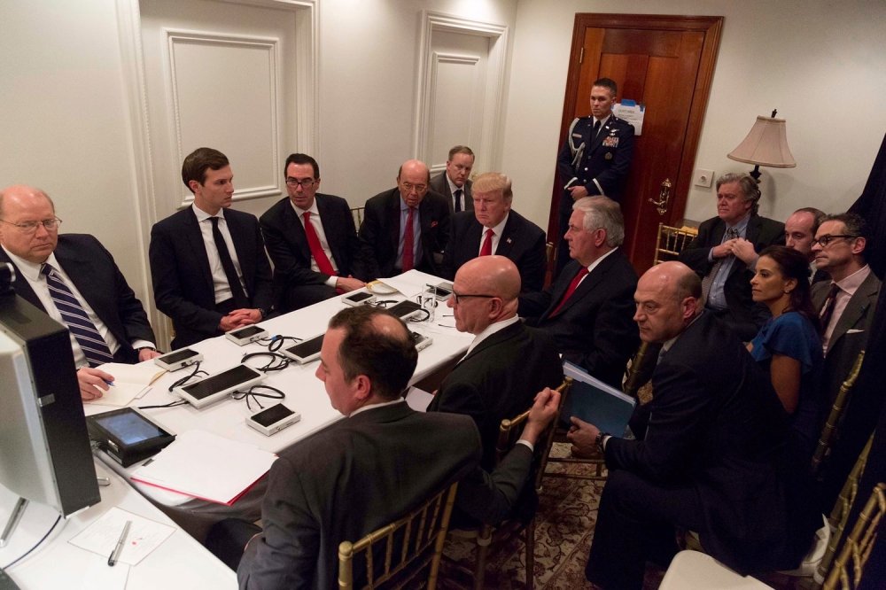 U.S. President Donald Trump is shown in an official White House handout image meeting with his National Security team and being briefed by Chairman of the Joint Chiefs of Staff General Joseph Dunford via secure video teleconference after a missile strike on Syria while inside the Sensitive Compartmented Information Facility at his Mar-a-Lago resort in West Palm Beach, Florida, U.S. April 6, 2017.