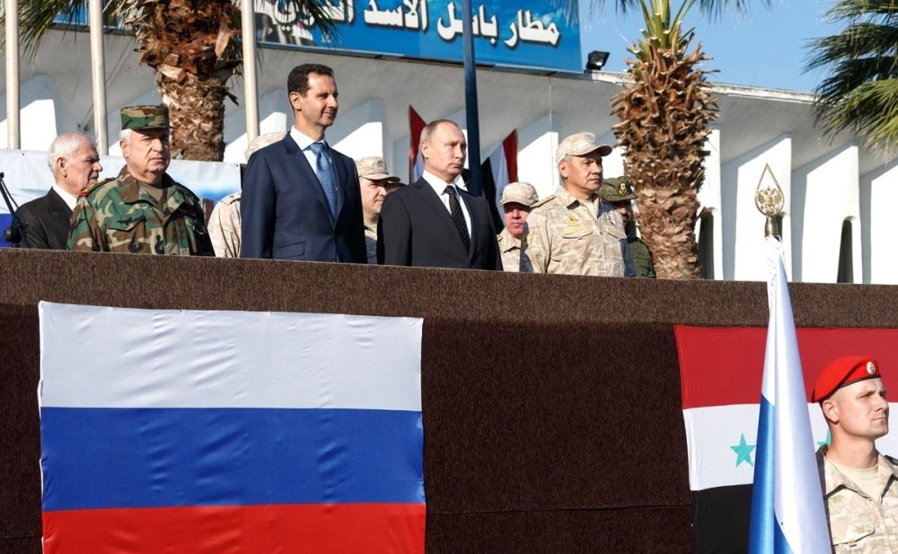 At the Khmeimim air base in Syria. With President of Syria Bashar al-Assad (left) and Defence Minister of Russia Sergei Shoigu (right). Source: Kremlin.ru