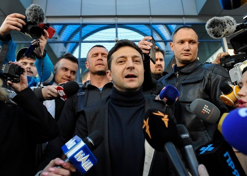 Volodymyr Zelenskiy talking to reporters in Kyiv. Source: Shutterstock.
