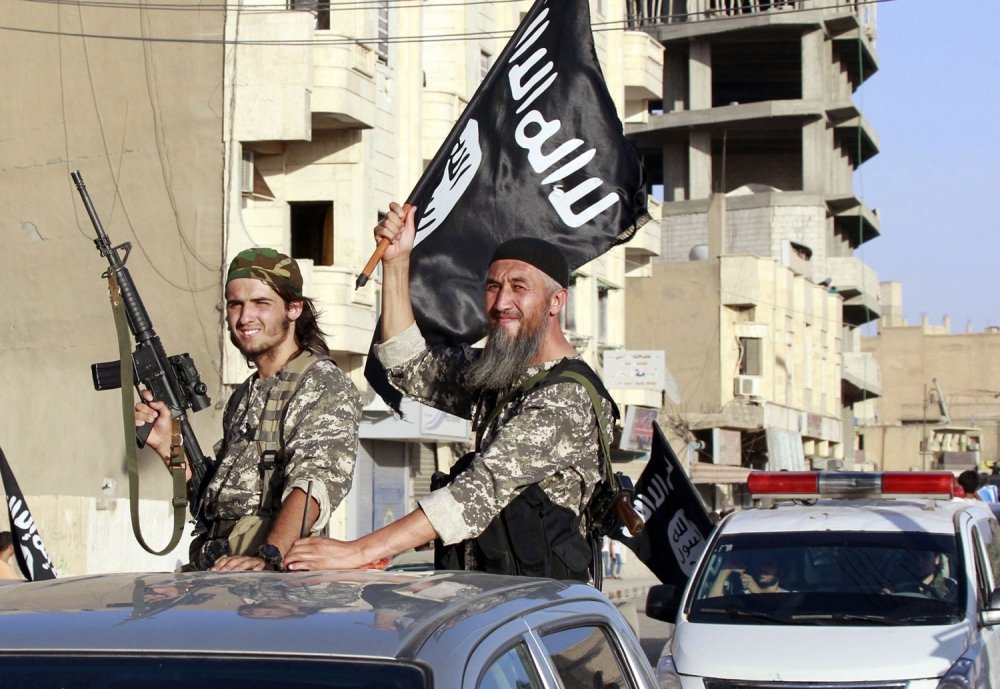 ISIS fighters in Raqqa, Syria. Photo by stringer, Reuters. Copyright 2014 Reuters; used with permission.