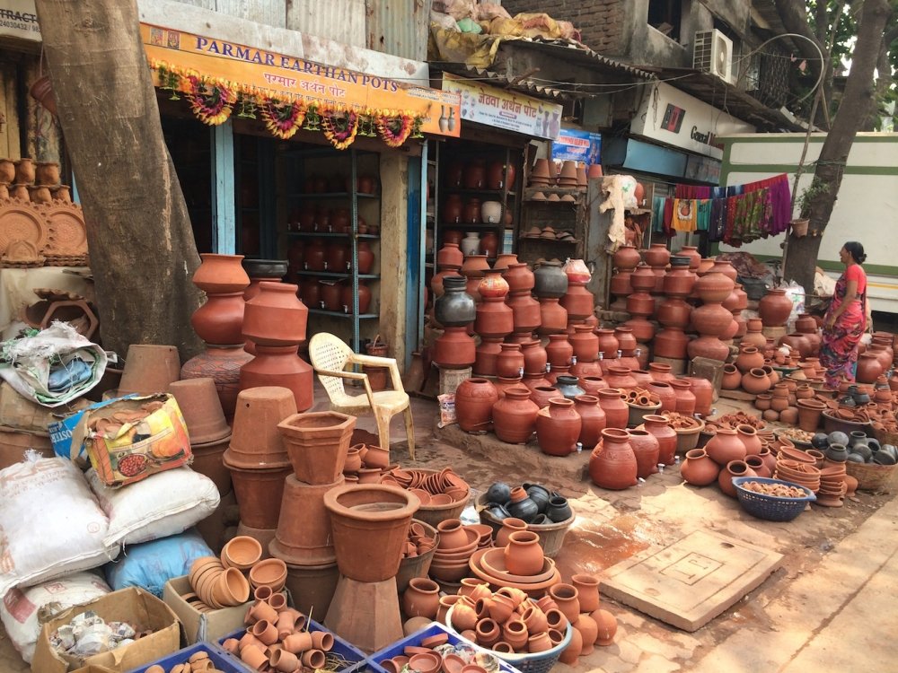 Outside a pottery shop in Dharavi, the largest slum in Mumbai and Asia. There are many microindustries in Dharavi; pottery is among the major ones. A significant proportion of pots in India are made and sold here.