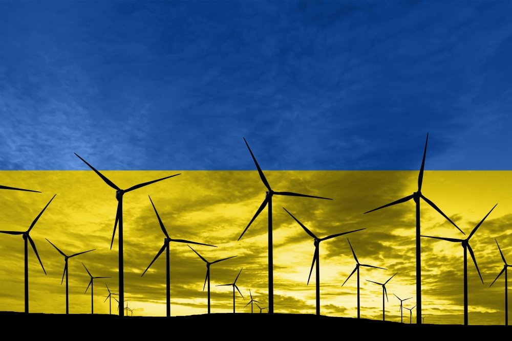 Ukrainian flag superimposed over wind turbines