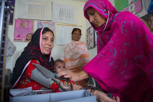 Tahira Rashid receives medical care from Dr. Fauzia Amin FMO (Female Medical Officer) at the BHO (Basic Health Unit), Dogran Kalan Union Counsil, Wagah, Punjab Province, Pakistan.