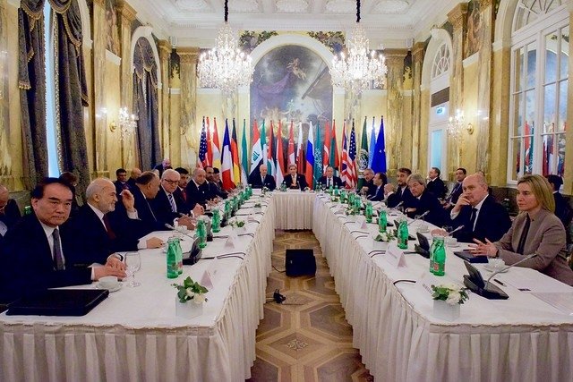 Diplomats sitting at table during Vienna talks