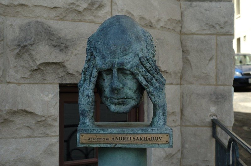 Bust of man holding head in hands