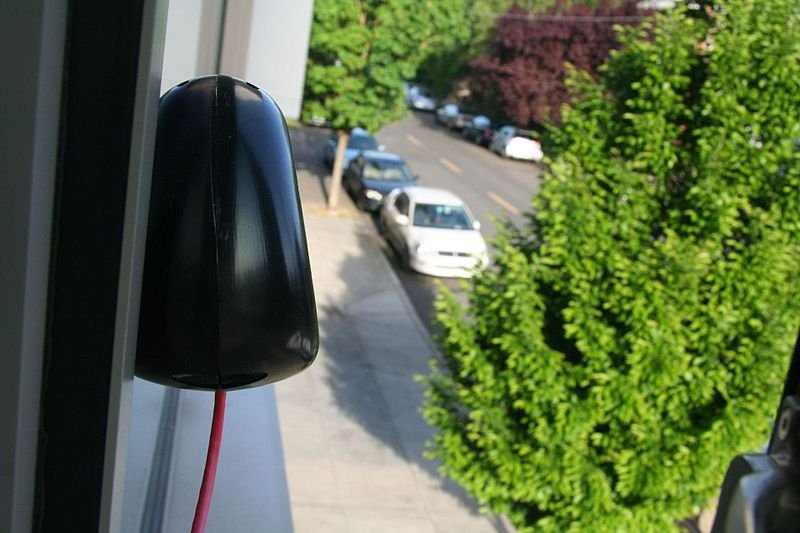 Air quality sensor attached to the outside of a building