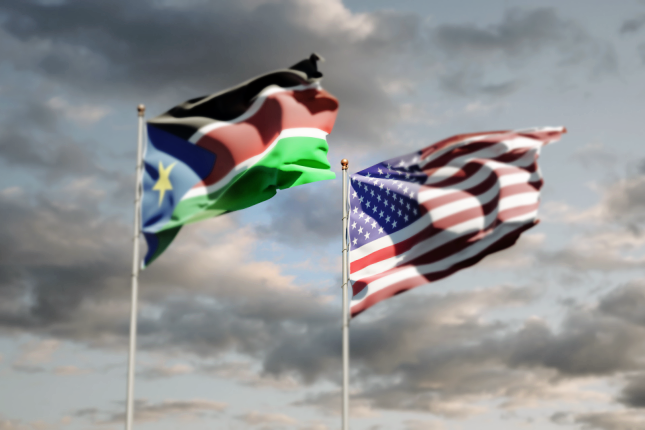 National flags of South Sudan and USA together at the sky background