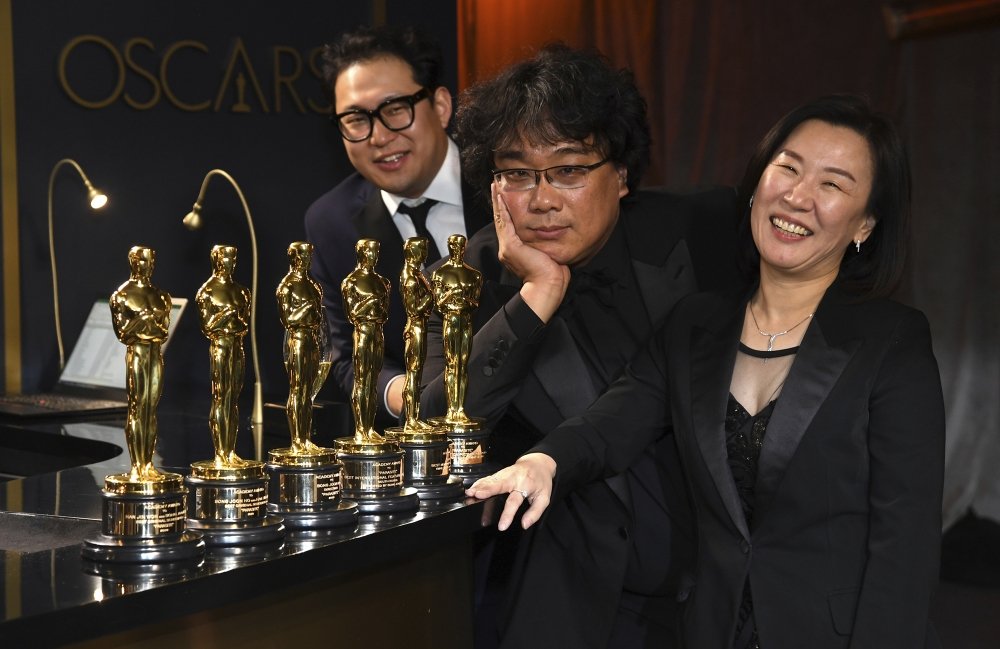 Han Jin Won, from left, Bong Joon-ho, and Kwak Sin Ae at the Oscars
