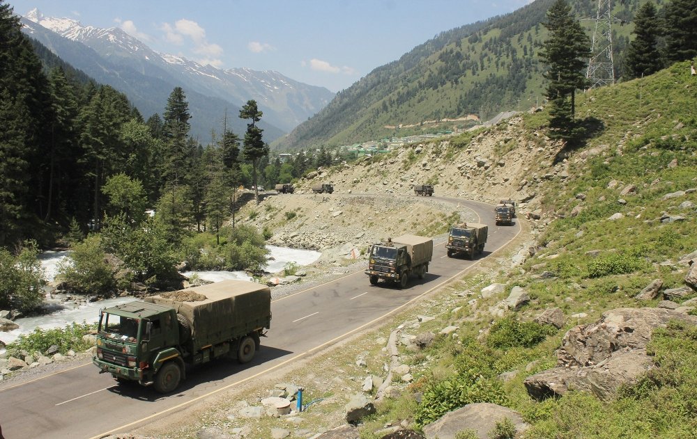 An Indian army convoy of trucks moving along the Srinagar-Ladakh highway.