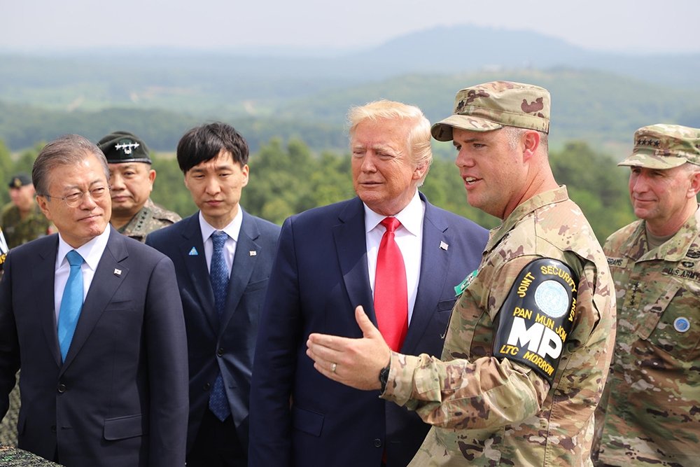 President Donald Trump speaking with Lt. Col. Sean Morrow at the DMZ.