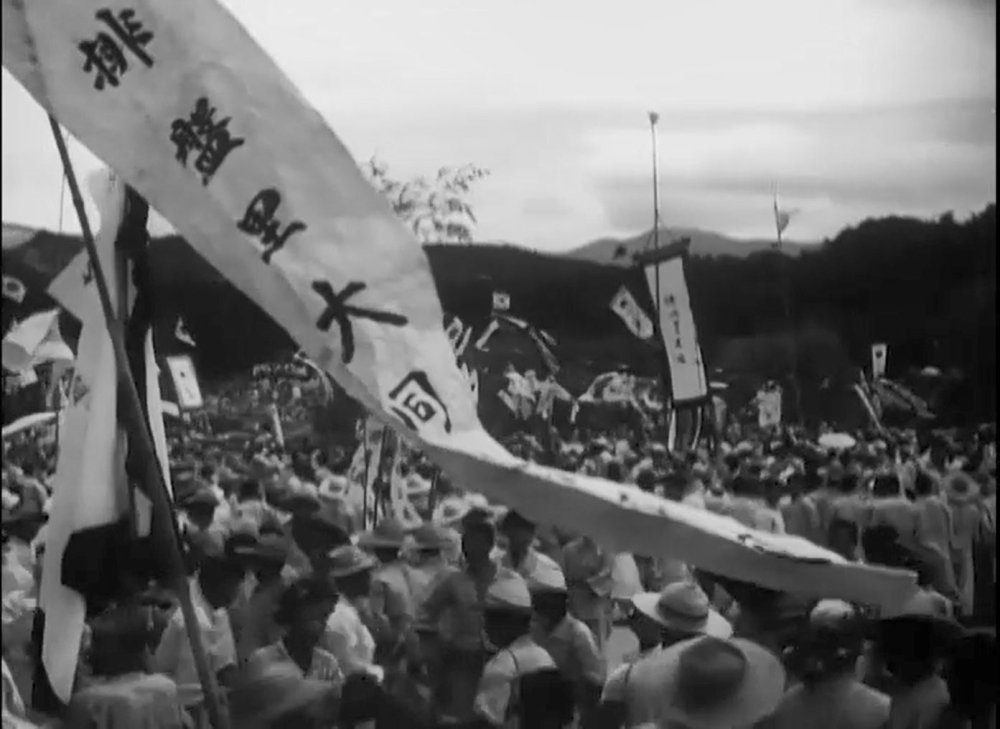 A banner with Korean text flies during a celebration.