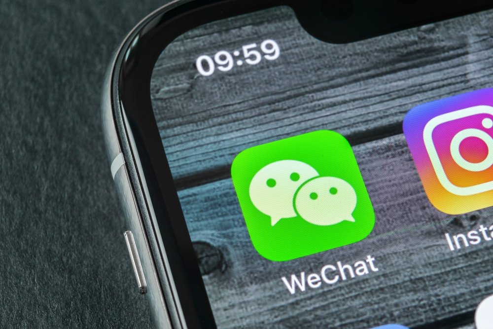 A phone showing the logo for the WeChat app